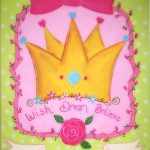 A pink and green painting with a crown on it.
