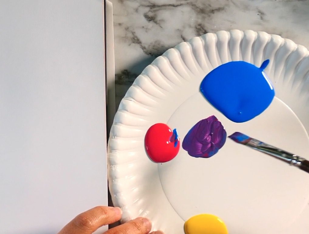 A group of ink splashes with one blue.