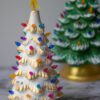Two "White & Gold" Ceramic Lit Christmas Tree Kits on a marble table.