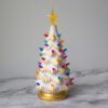 A "White & Gold" Ceramic Lit Christmas Tree Kit on a marble table.