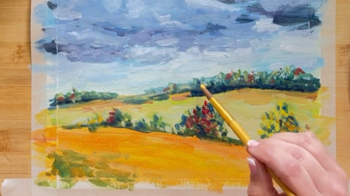 A person is painting a landscape with a brush.